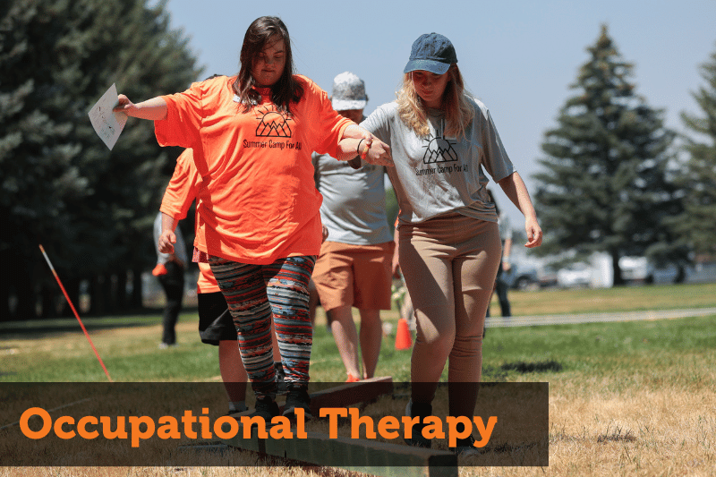 Text reads: Occupational Therapy. Image: A woman in a grey shirt, that reads Summer Camp for All, helps a girl with down syndrome, who is wearing a matching orange shirt, down a balance beam