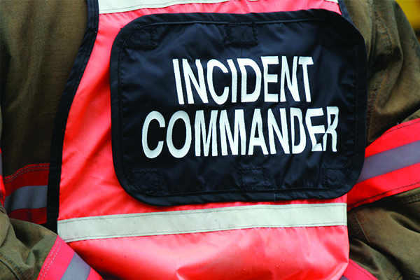 Image of incident commander responder in orange vest