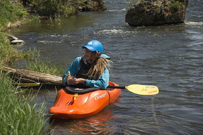 05-29-18 McKenna Adams studying salmonflies; Middle Fork Salmon River. Photo by Eric Gordon, University Photographer.