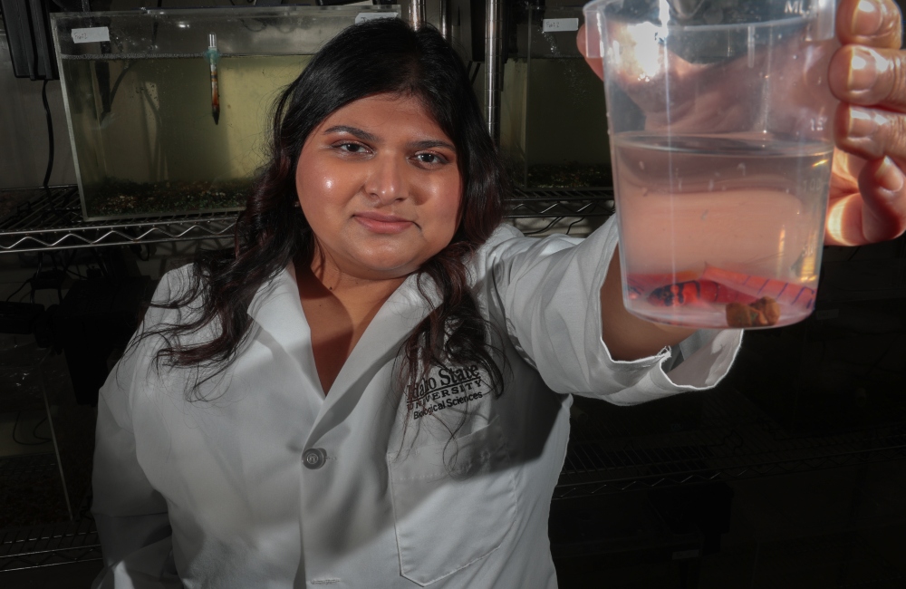 Dr. Devaleena Pradhan poses for a photo with Lythrypnus dalli, Blue-banded goby in her lab