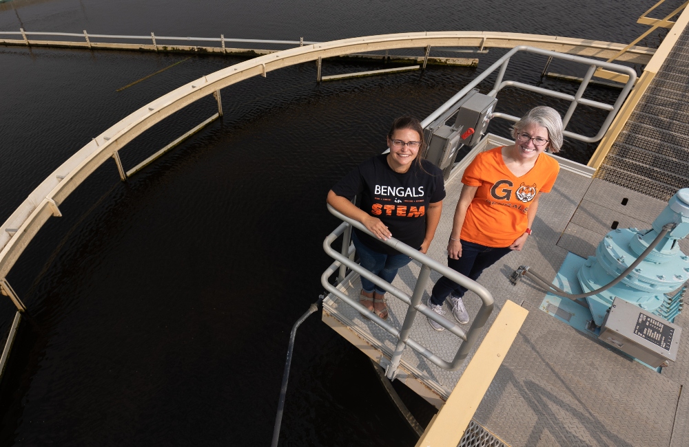 Dr. Julia Martin and Emily Beargen pose at the Pocatello wastewater treatment plant. They collect wastewater in East Idaho to look for COVID-19.
