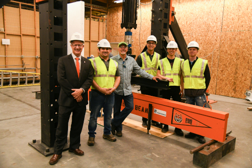 Dream Beam Team standing in front of their beam