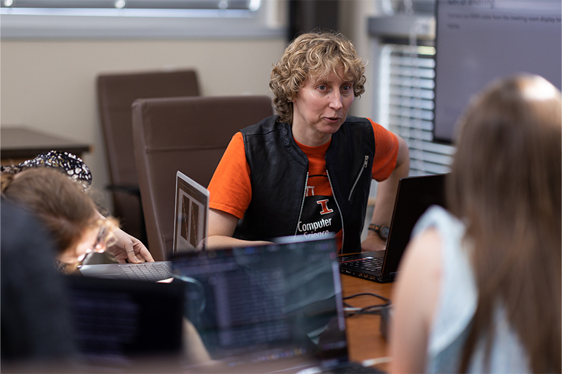 Leslie Kerby, associate professor of computer science, works with students.