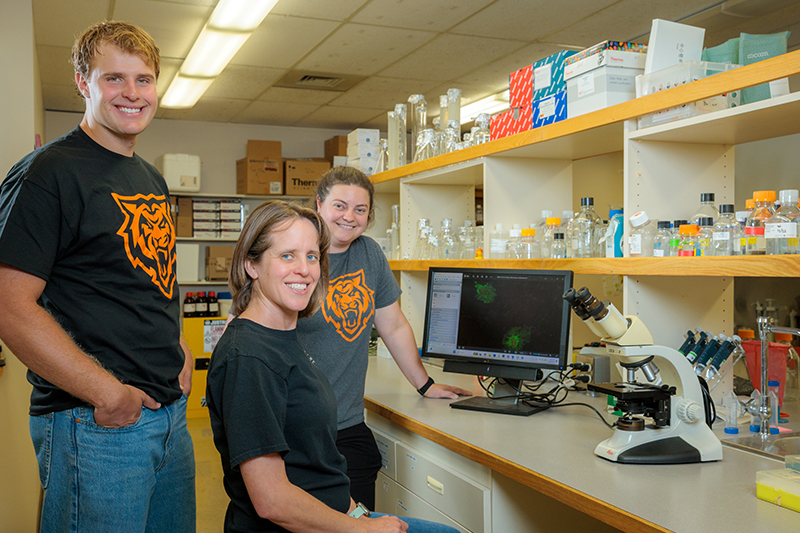 Mason Mickelsen, Kinta Serve, and Larisa McOmber pose for a photo in a lab on ISU’s Pocatello campus.
