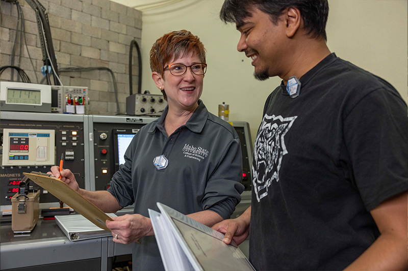 Mary Lou Dunzik-Gougar with doctoral student Maruf Anwarul at the nuclear reactor.