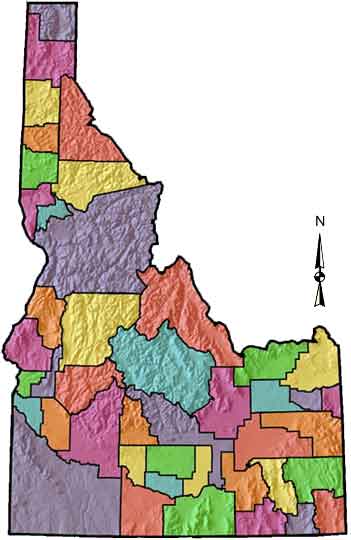 Color-coded county map of Idaho showing topographical terrain and a North arrow indicator.