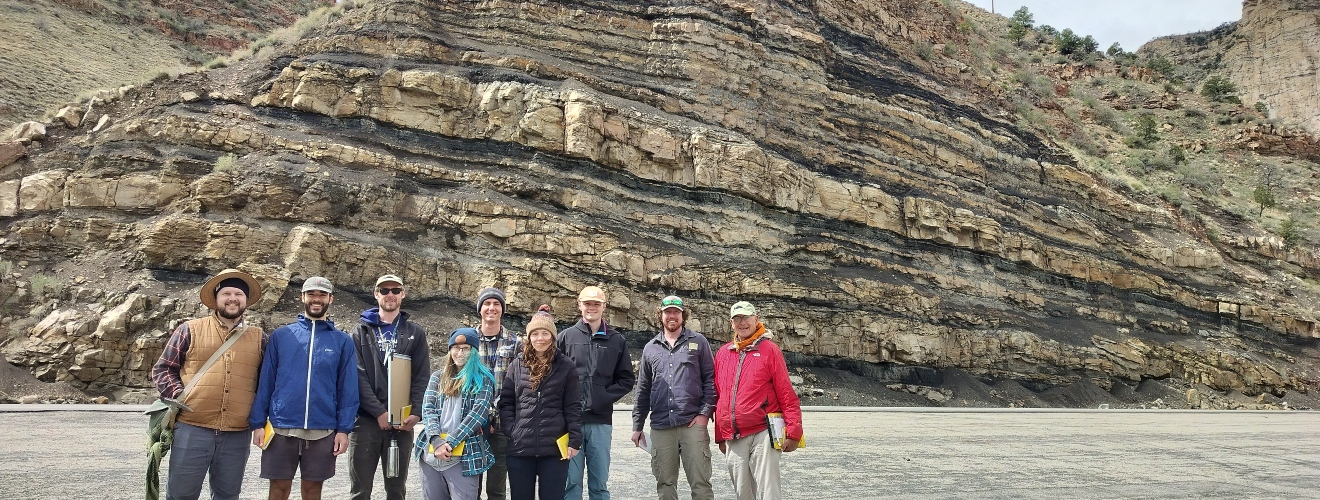 ISU Geosciences students and professors pose in front of Blackhawk Formation near Price, Utah
