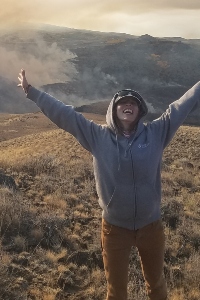 Michelle Sclafani poses in front of a burn, crucial to her thesis completion, finally happening, despite the federal government's potential shutdown