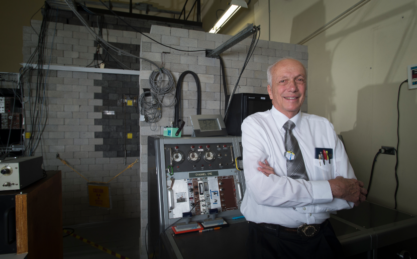 Jay Kunze standing in front of the nuclear reactor