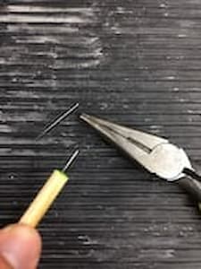 Small nail in the end of a dowel