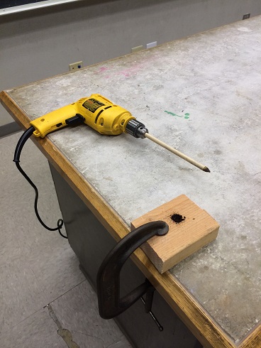 A dowel in a drill as the bit