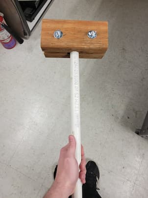 2 wood blocks tightly fastened to a pvc pipe