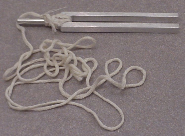 A tuning fork tied with a rope tied around it