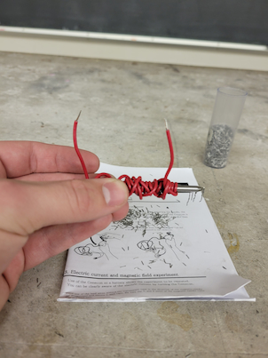 A nail with wire wrappings around it