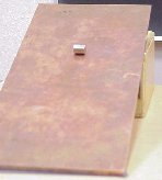 Magnet rolling down a copper plate