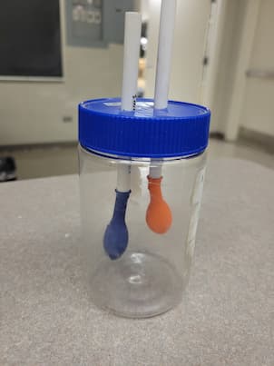 2 Balloons in a jar connected by jars