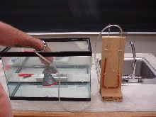 A pressure manometer that the pressure is measured by a funnel in a fish tank
