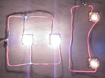 A board with two lightbulbs in series and 2 light bulbs in parallel