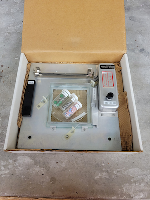 A box full of pieces for a molecular motion detector
