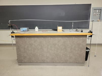 A wave driver showing standing waves on a string