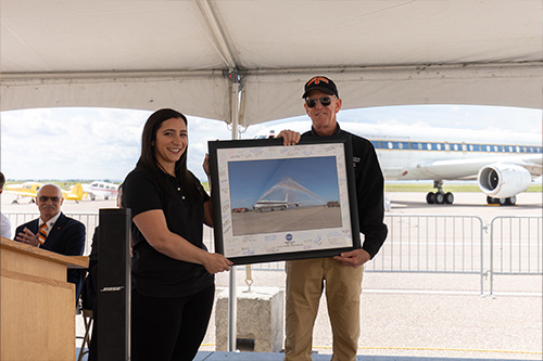 Debra K. Ronneburg and Mackenzie Gorham presenting Michael Stevenson with an Award