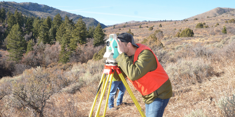 Surveying and Geomatics Engineering Technology Student working in the field