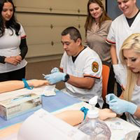 Nursing students working in lab