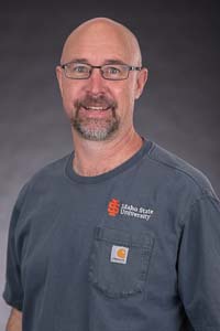 Lucas Bloxham Welding Instructor holding a fish