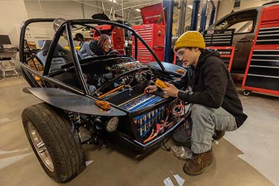 Automotive Technology students workin on a SWITCH car