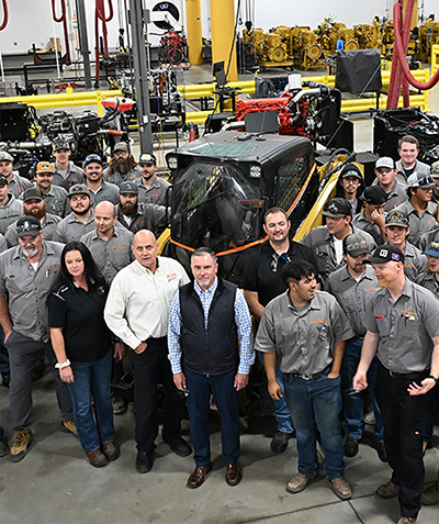 Students and Industry Partners Standing next to a skidster donated to the College of Technology by Kiewit Equipment company.