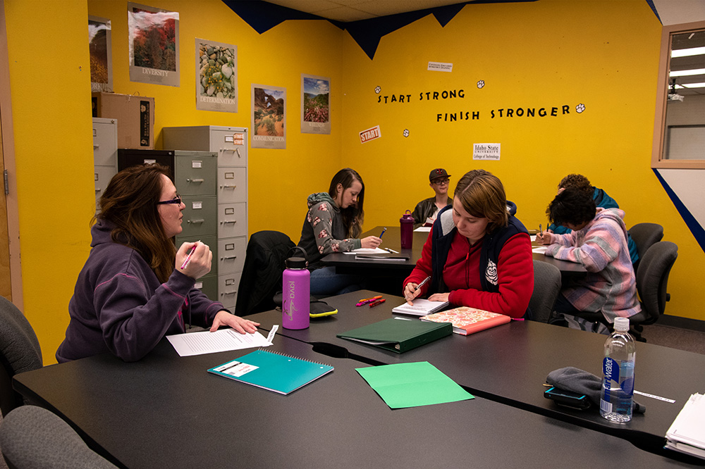 Students working at tables in small groups