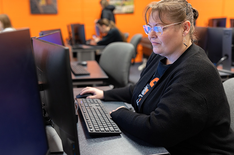 Administrative Technology student working in a computer lab