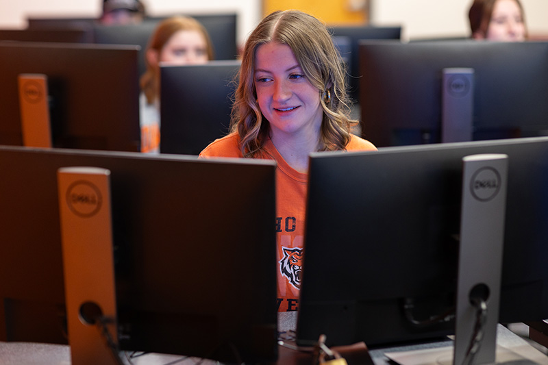 Hospitality Management student at the computer