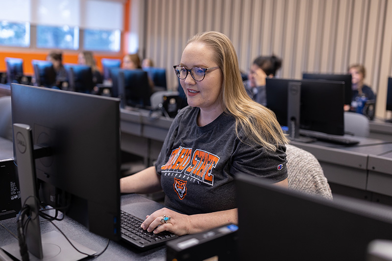 Small Business Technology student working at a computer