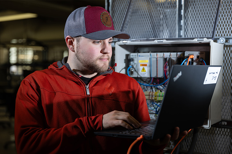 Student working in the Industrial Cybersecurity Engineering Technology lab