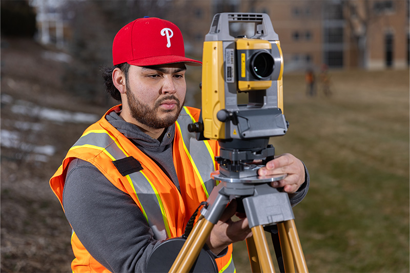 Civil Engineering student working on equipent