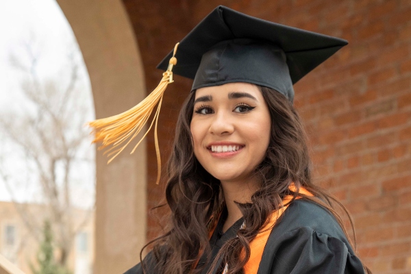 Graduates dressed in cap and gown