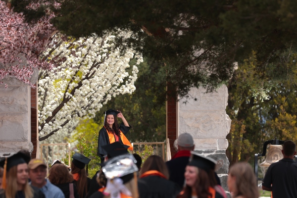 Student walking through the arch