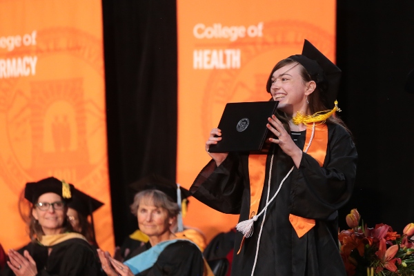 Student showing his diploma