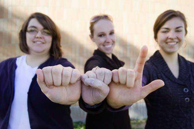 Sign language student practicing signs