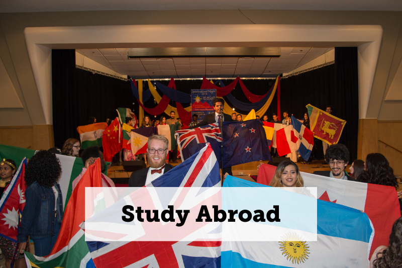 Image: A group of people holding flags from various countries. Text: 