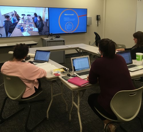 Students attending synchronus online class through distance-learning.
