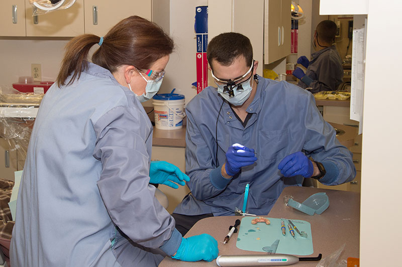 Student learns dental repair techniques