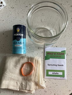 bowl, salt, seeds, cheesecloth picture- supplies needed to grow alfalfa sprouts