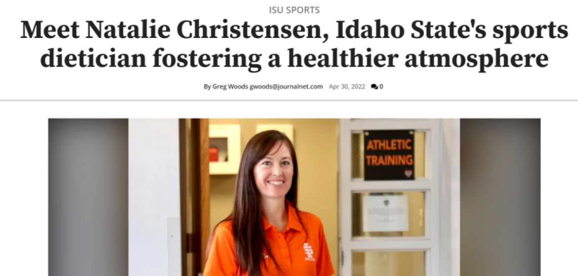 White female dietitian standing in front of office in ISU athletic center