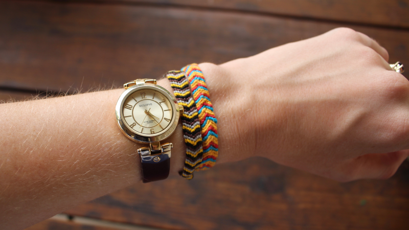 Wrist with watch and woven bracelets