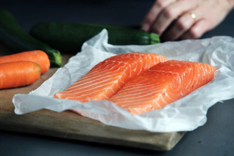 Picture of 2 pices of salmon in wrapping paper, waiting to be prepared for a delicious dinner