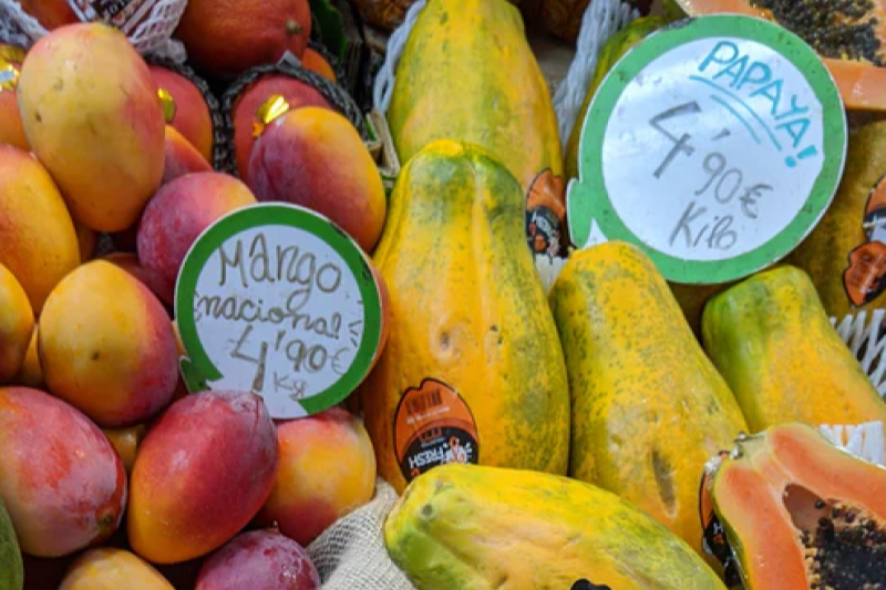 mangos for sale at a fruit stand