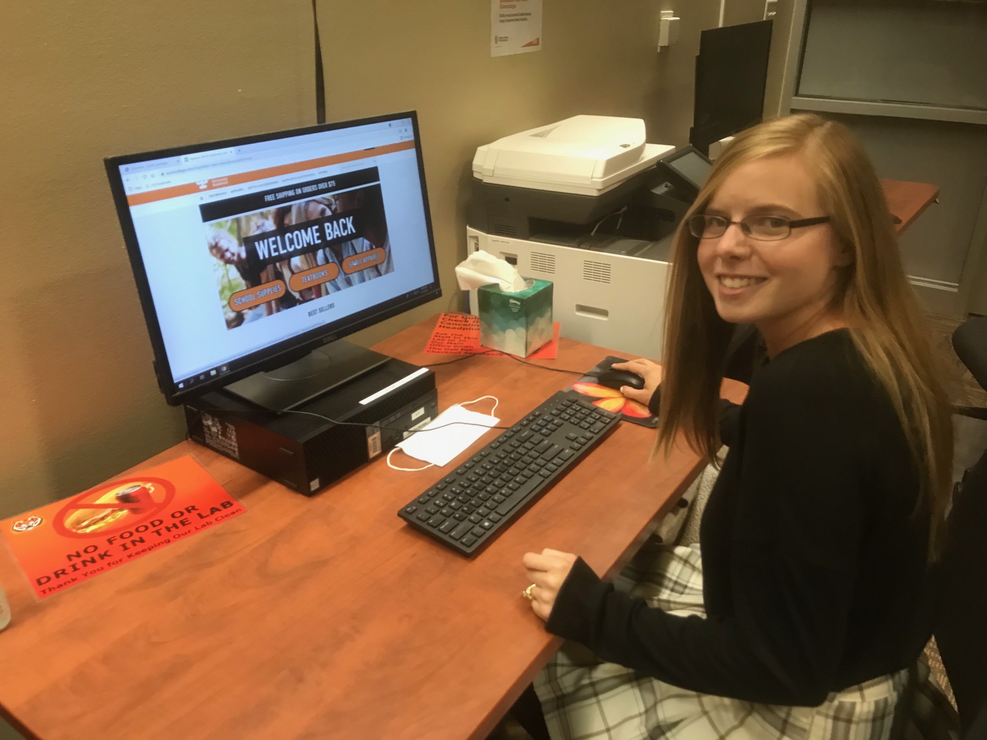 Emily Logue sitting at a computer.