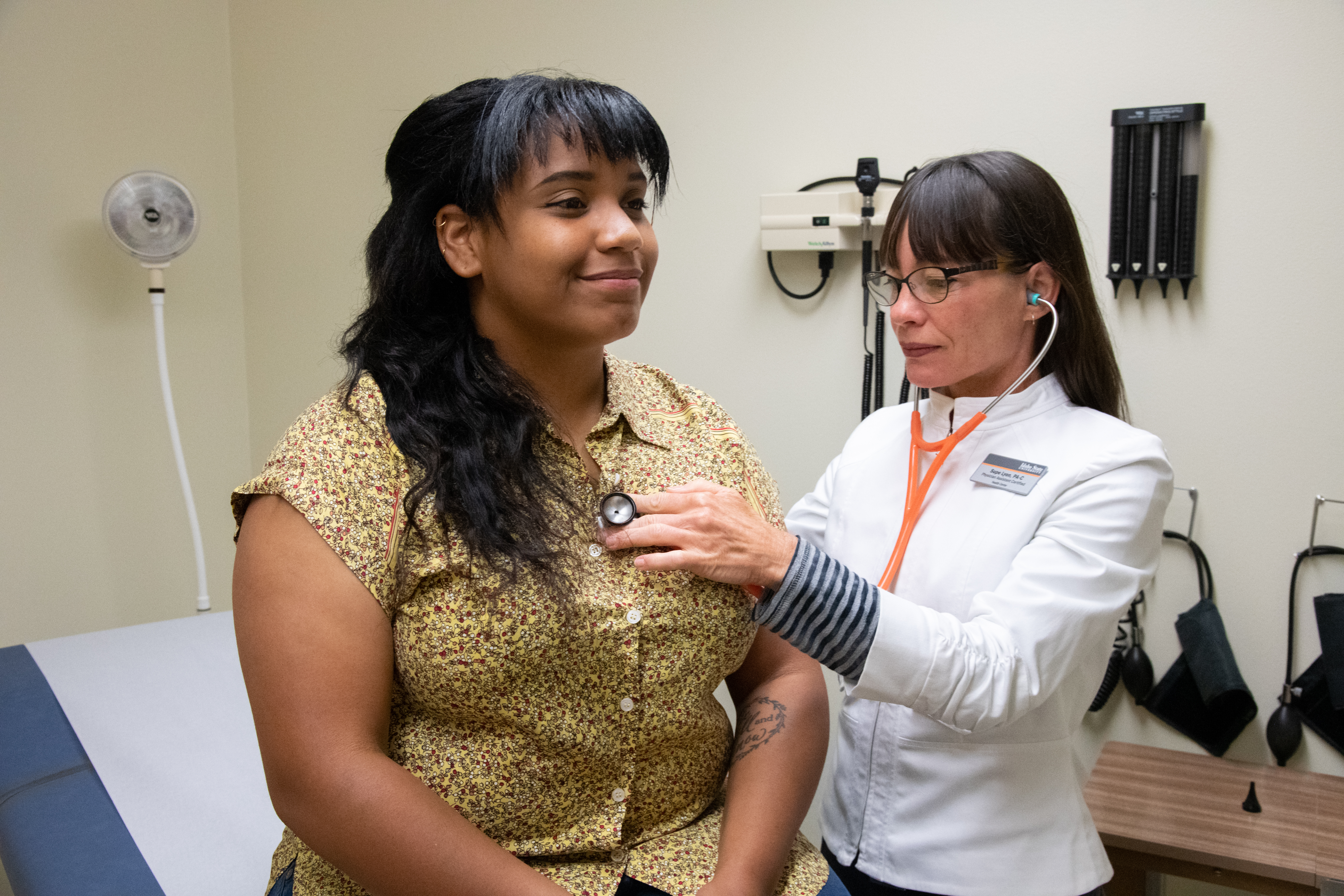 A female ISU students being checked by a health care provider at ISU Health Center
